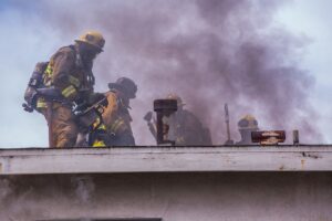 firefighters on house on fire