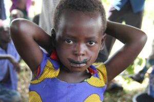 Child with charcoal mustache