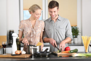 woman and man cooking